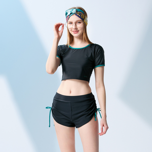 Made in Taiwan, limited edition dark green fitted short-sleeved two-piece swimsuit for young women.
